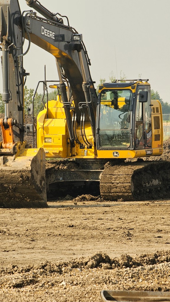 John Deere excavator on a job site