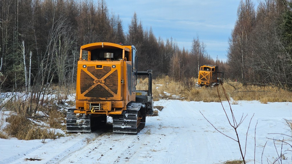 Tracked equipment on a snow-covered job site