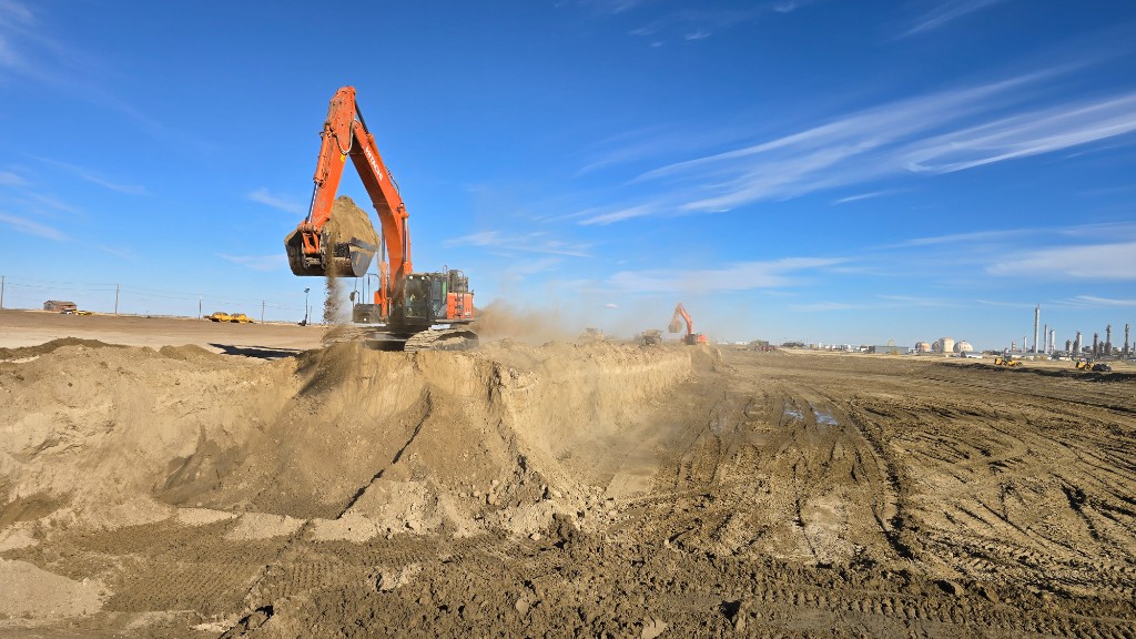 Large utility pipe at a street excavation with soil, water or sewer main work